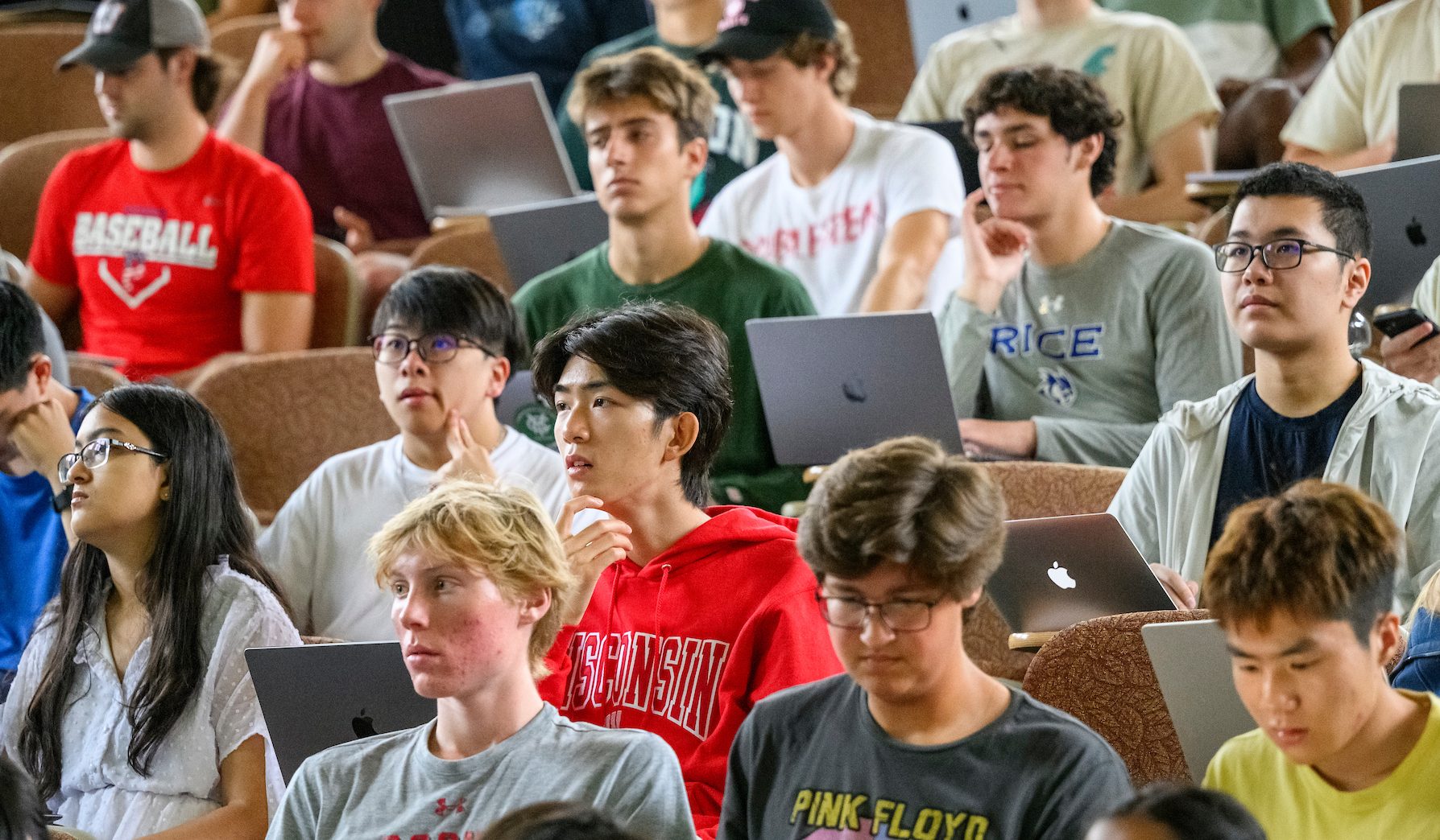 Students sit in a lecture hall